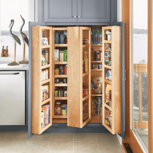 Custom-built pantry shelving designed by interior decorators in Paarl, showcasing a clever storage solution for maximizing kitchen space. The pull-out shelves neatly organize canned goods and pantry items, demonstrating how innovative storage can keep your home functional and clutter-free without sacrificing style. this shows one of Live In Tastes interior design tips for small spaces.