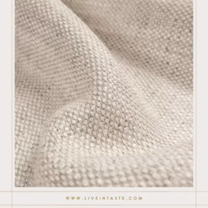 Close-up of a textured, neutral-toned fabric, ideal for adding understated elegance and comfort in interior design for homes in Paarl, blending style with practicality.